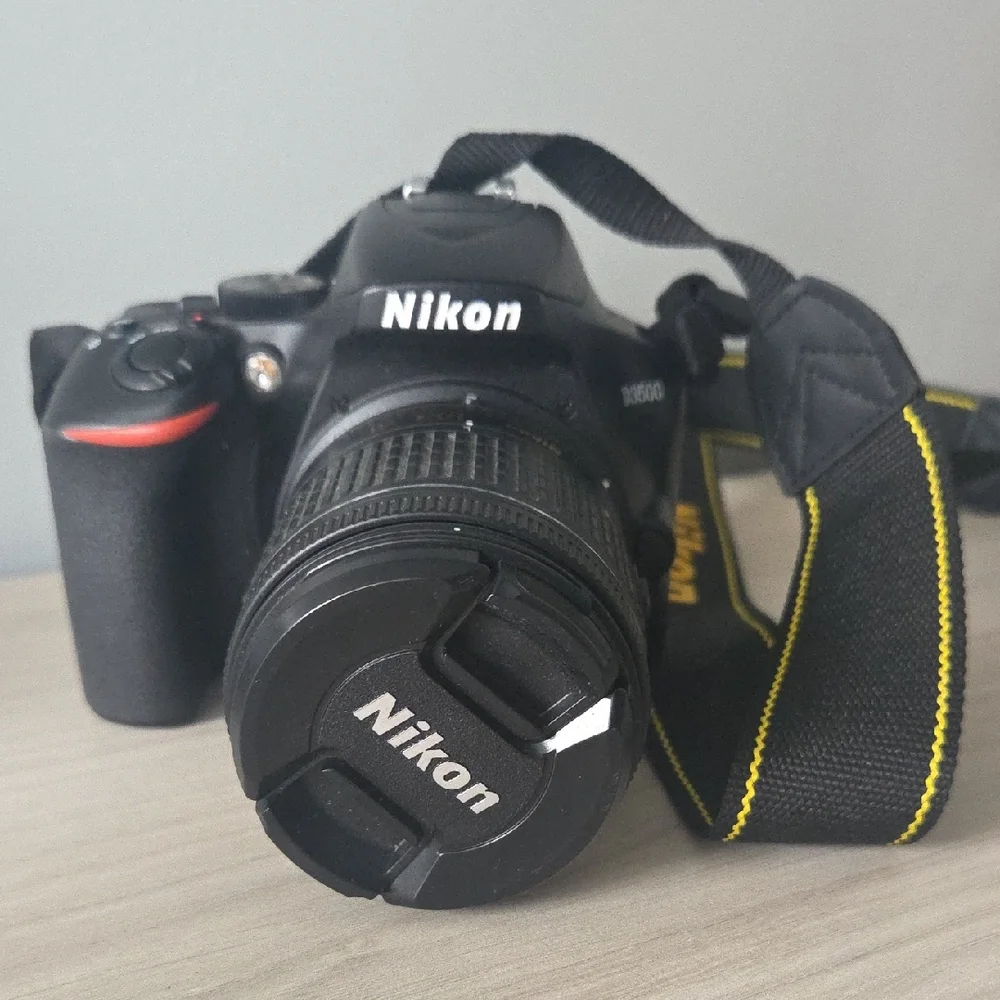 Nikon Black Camera D3500 with Zoom Lens and Black/Yellow Strap/ Charger Included